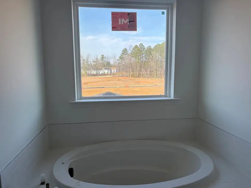 Primary Bath featuring the AW Collection® Rosemary - Organic textures meet bold design. Primary Bath featuring the AW Collection® Rosemary - Organic textures meet bold design.