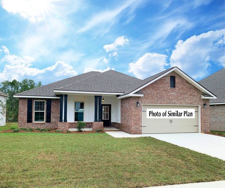 Front exterior of a home in the The Bluffs at Lafayette community, located in Freeport, FL (Image 11).
