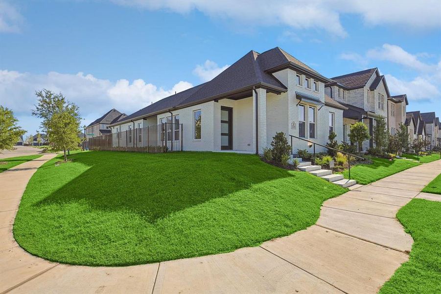 View of side of home with a lawn