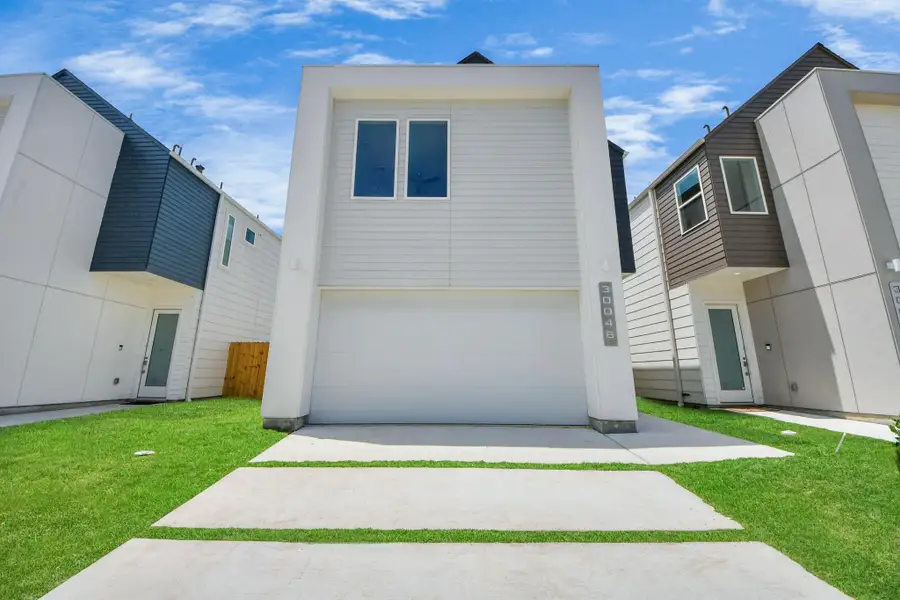 Front exterior of a new home in Alicante, Houston, TX, highlighting curb appeal (Image 1).