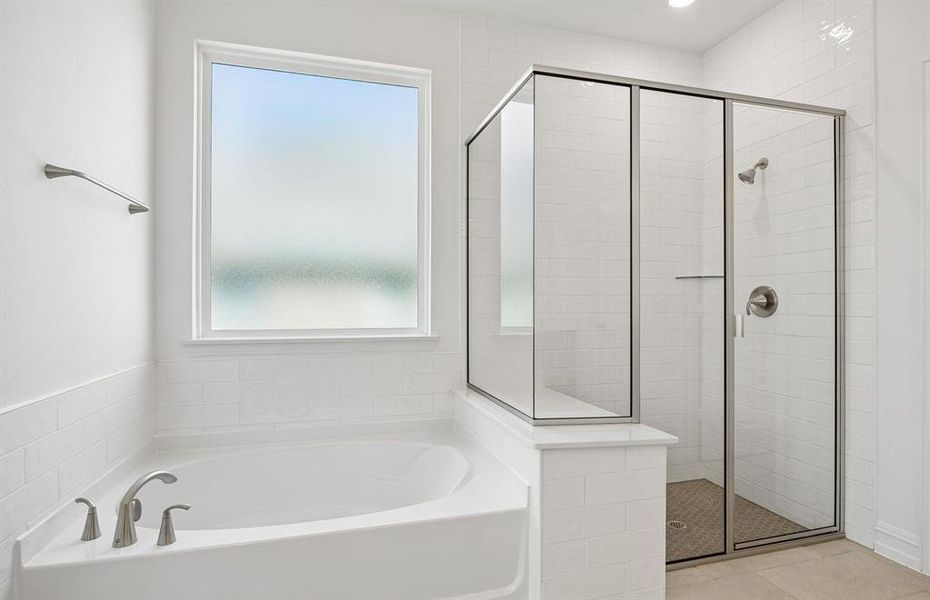 Owners private bath with tub and separate shower