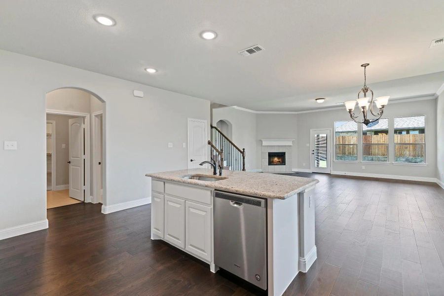 Kitchen to Family Room | Concept 3015 at Silo Mills - Signature Series in Joshua, TX by Landsea Homes