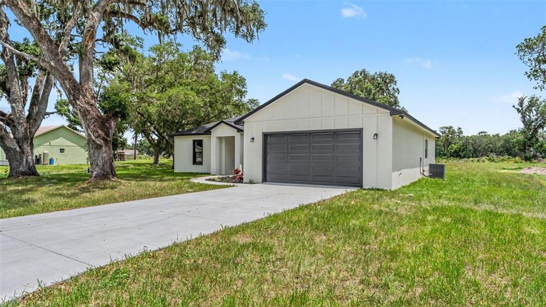 Front exterior of a new home in , Bartow, FL, highlighting curb appeal (Image 28). Front exterior of a new home in , Bartow, FL, highlighting curb appeal (Image 28).