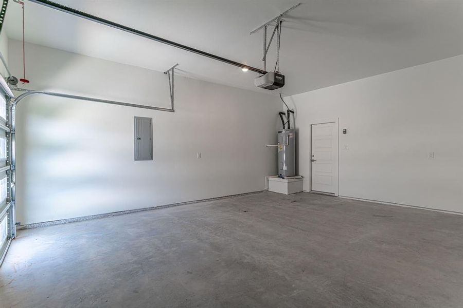 Garage with hot water heater and breaker box