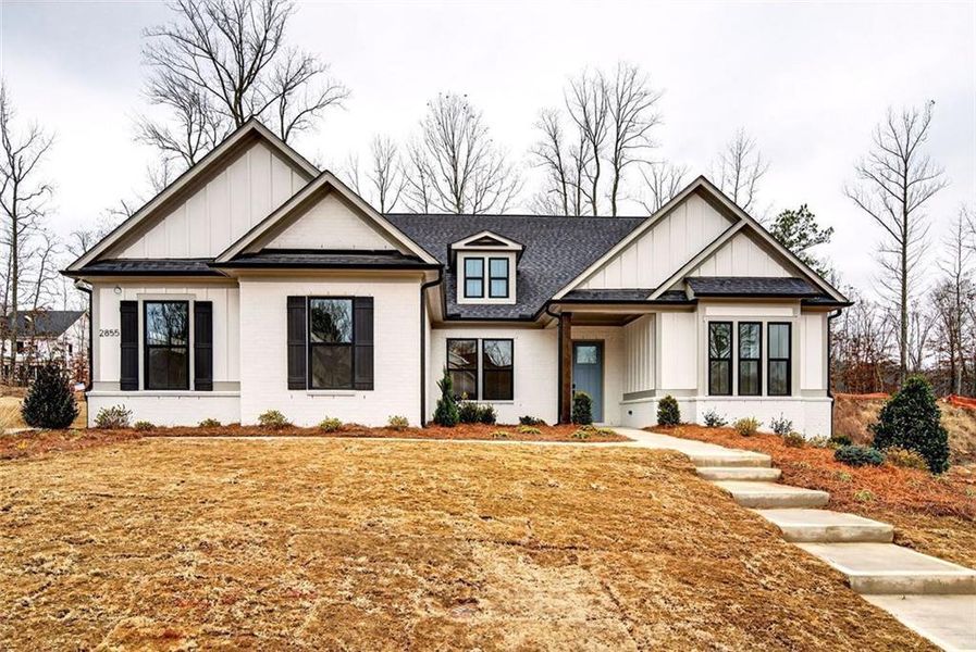 Front exterior of a new home in , Cumming, GA, highlighting curb appeal (Image 26). Front exterior of a new home in , Cumming, GA, highlighting curb appeal (Image 26).