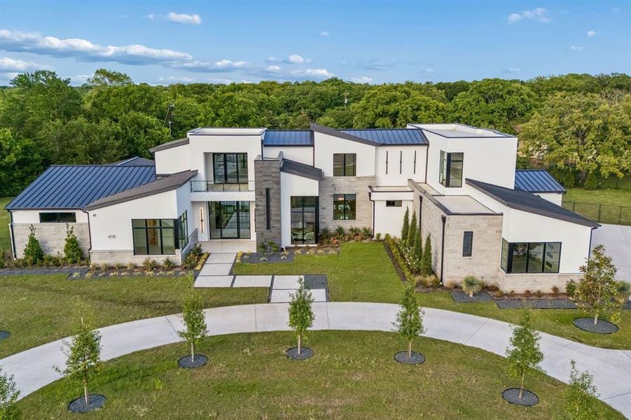 Front exterior of a new home in , Southlake, TX, highlighting curb appeal (Image 1). Front exterior of a new home in , Southlake, TX, highlighting curb appeal (Image 1).