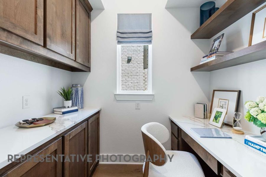 Office area featuring baseboards and wood finished floors Office area featuring baseboards and wood finished floors