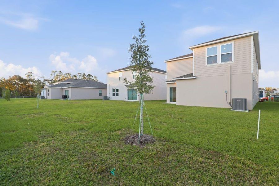 Exterior details and patio area of a home in Palm Wind, Hudson (Image 4).