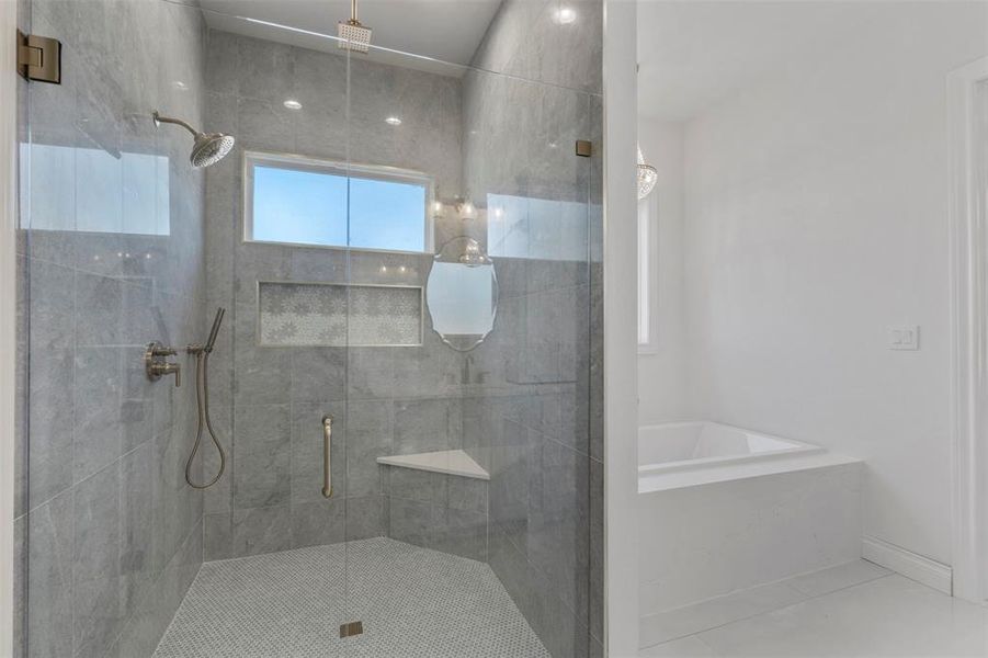 Bathroom with separate shower and tub and tile patterned flooring