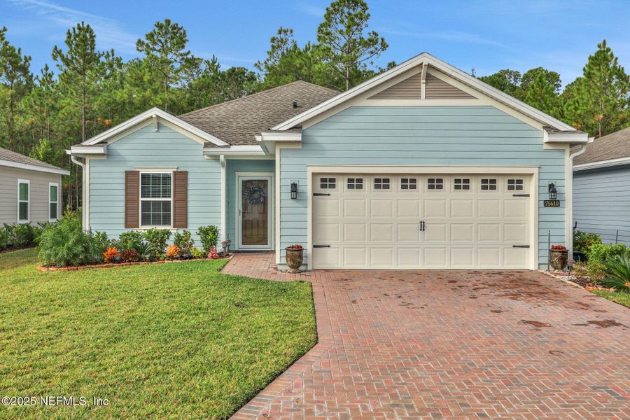 Exterior details and patio area of a home in Tributary: Lakeview at Tributary 50's, Yulee (Image 23).
