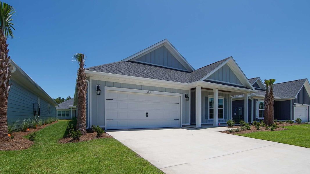 Front exterior of a new home in Breakfast Point East Phase I, Panama City Beach, FL, highlighting curb appeal (Image 22).