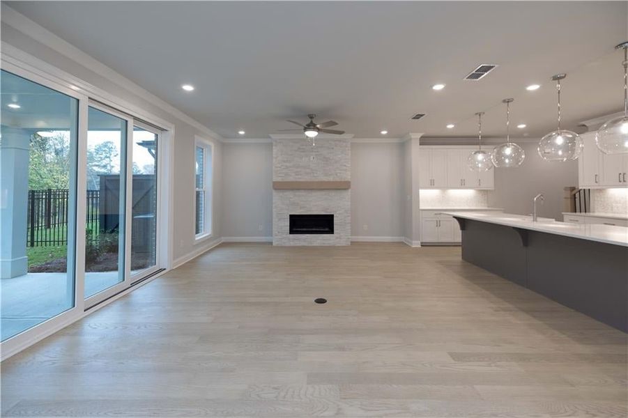 A beautiful fireplace will keep you warm and cozy in the cooler months. *Please note photos shown are of the Ellington plan but not of the actual home.