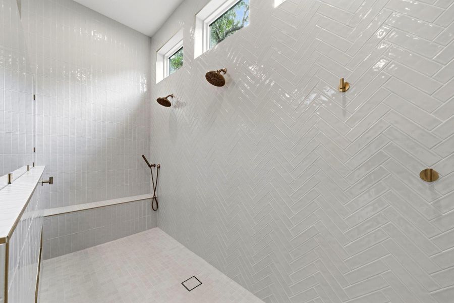 Oversized shower with dual heads, bench, and handheld Oversized shower with dual heads, bench, and handheld