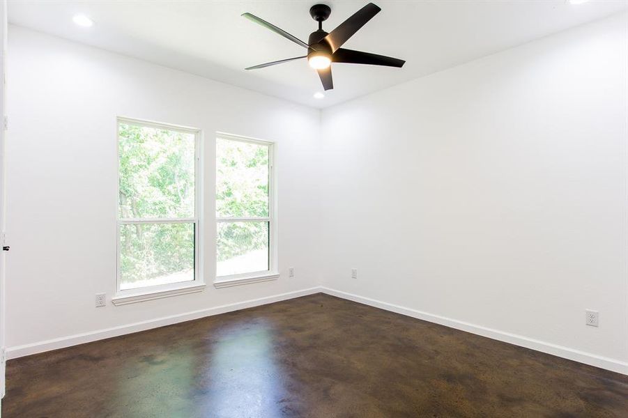 Empty room #3 featuring a wealth of natural light and ceiling fan