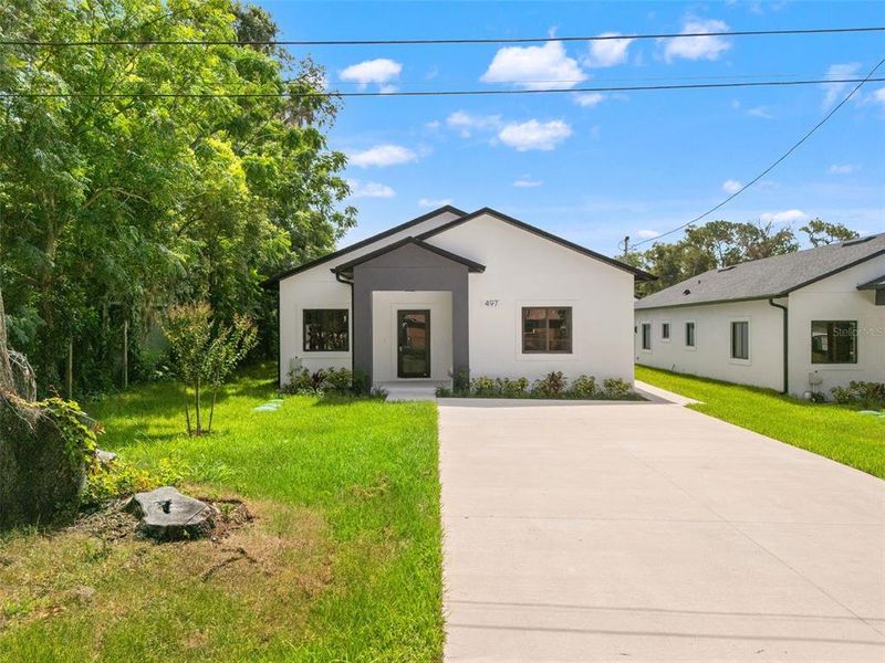 Front exterior of a new home in , Apopka, FL, highlighting curb appeal (Image 21). Front exterior of a new home in , Apopka, FL, highlighting curb appeal (Image 21).