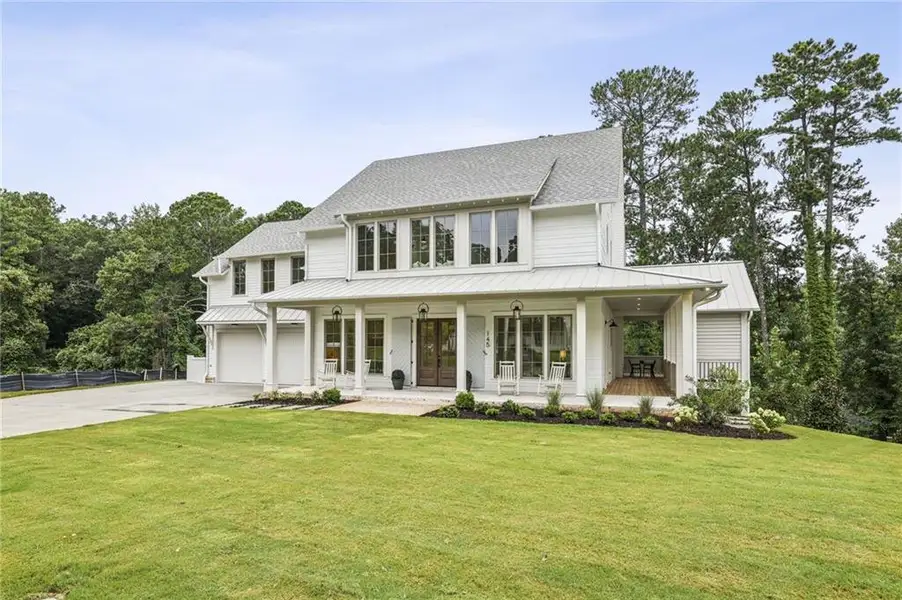 Front exterior of a new home in , Roswell, GA, highlighting curb appeal (Image 1). Front exterior of a new home in , Roswell, GA, highlighting curb appeal (Image 1).