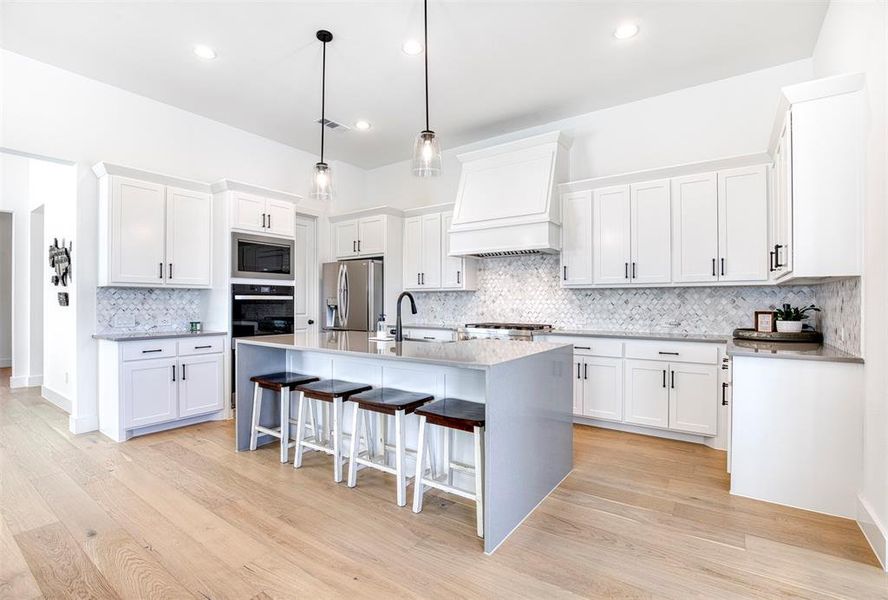 Large island with plenty of seating space for families and guests.