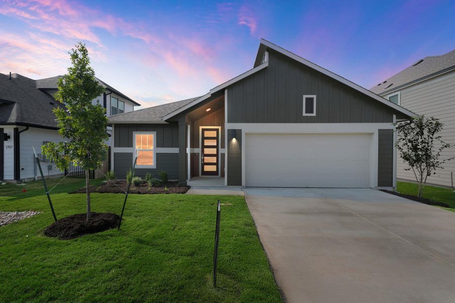 View of front of home featuring board and batten siding, driveway, a yard, a garage, and roof with shingles View of front of home featuring board and batten siding, driveway, a yard, a garage, and roof with shingles