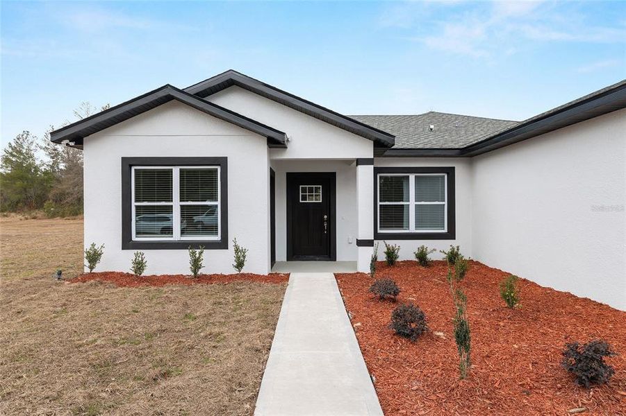 Front exterior of a new home in , Ocala, FL, highlighting curb appeal (Image 28). Front exterior of a new home in , Ocala, FL, highlighting curb appeal (Image 28).