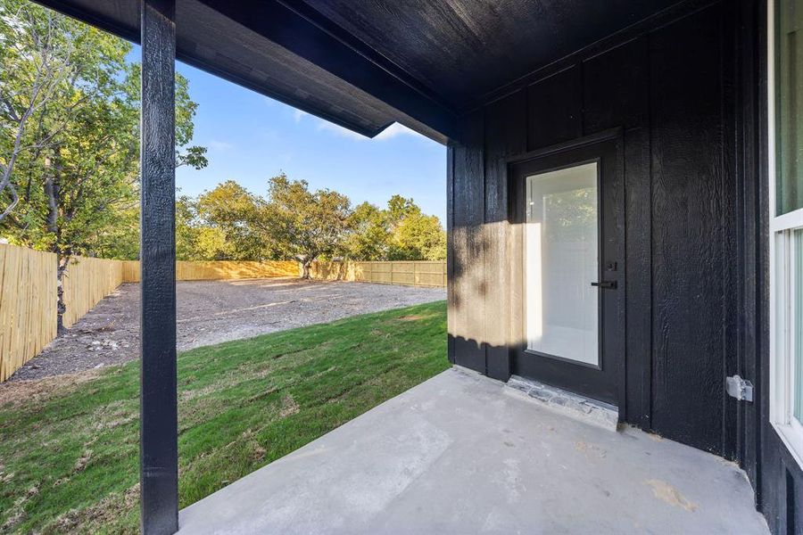 Fenced backyard with a patio area