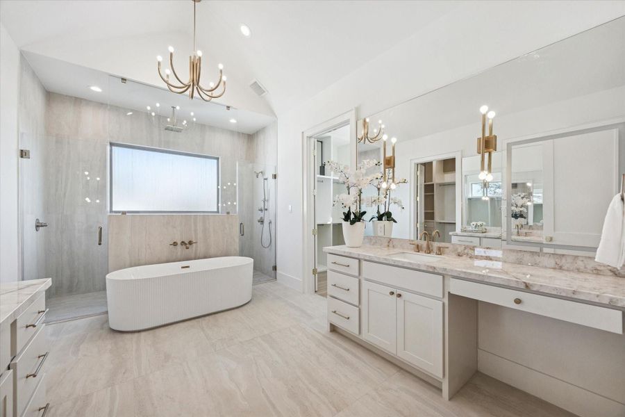 The 8 light candle style chandelier sets the tone for this spa like bath. The large shower features a Delta Trinsic shower system with rain shower, handheld sprayer and pressure balance valve.