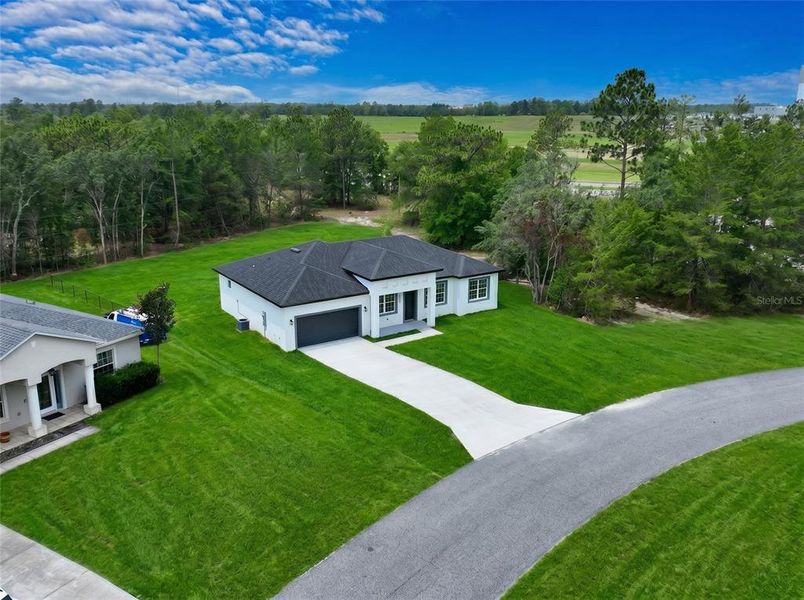 Front exterior of a new home in , Ocala, FL, highlighting curb appeal (Image 20). Front exterior of a new home in , Ocala, FL, highlighting curb appeal (Image 20).
