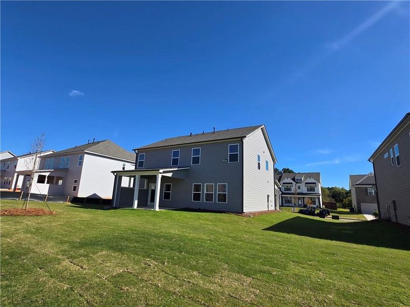Exterior details and patio area of a home in Enclave at Logan Point, Loganville (Image 4).