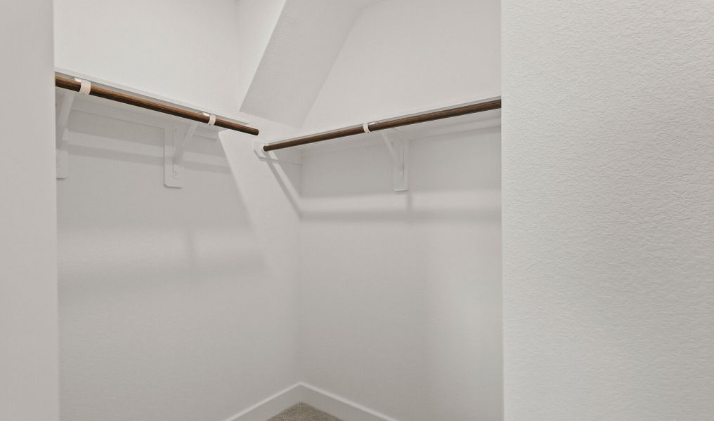 Primary Suite Walk-In Closet Primary Suite Walk-In Closet