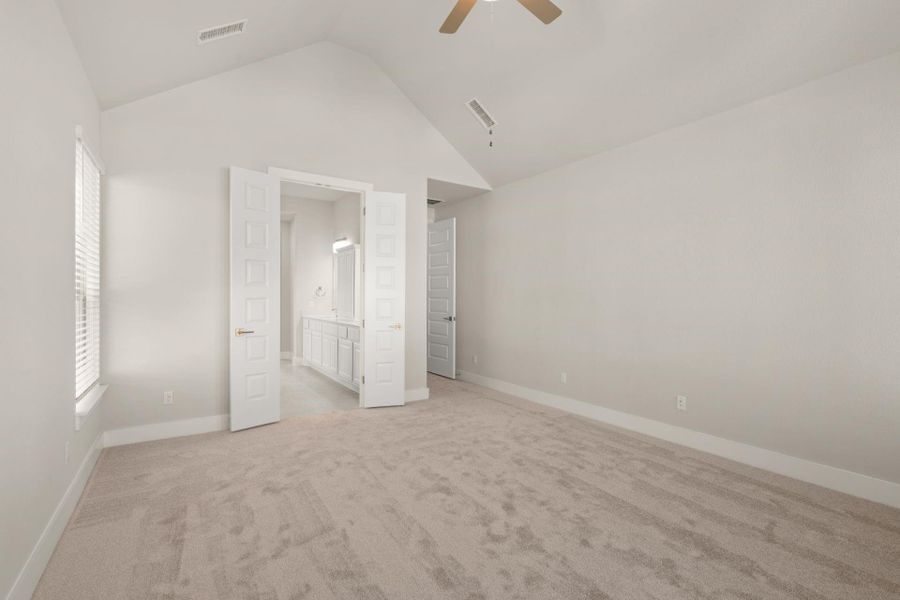 Primary Bedroom with elevated ceiling