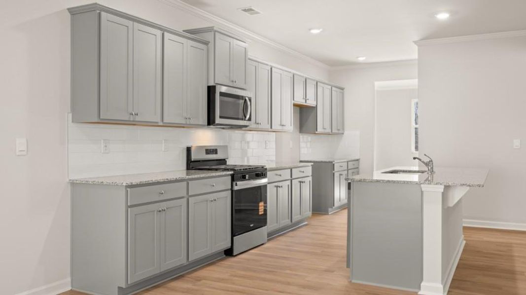 Furnished interior view inside a new home in Northwoods at Mirror Lake, Villa Rica (Image 6).