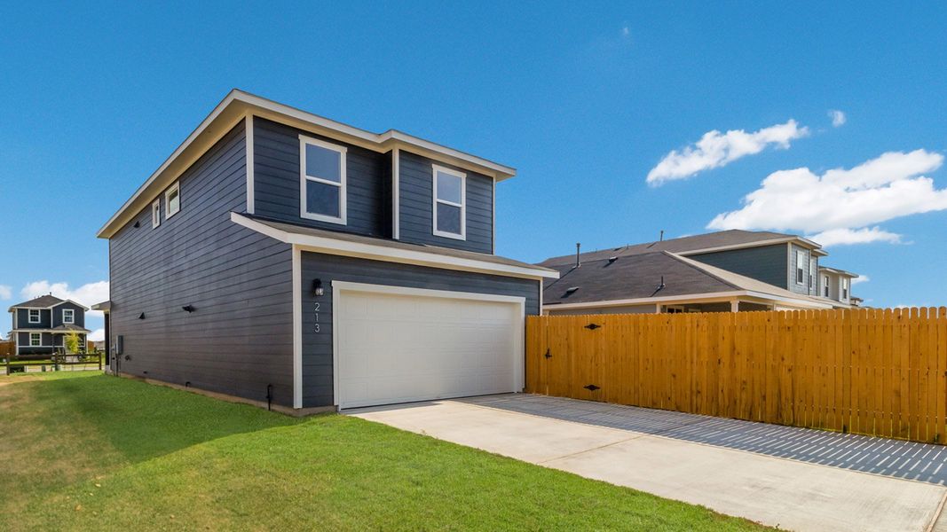 Representative exterior photo of a completed home built from the The Buchanan by D.R. Horton in Valverde, Bastrop, TX (Image 5). Representative exterior photo of a completed home built from the The Buchanan by D.R. Horton in Valverde, Bastrop, TX (Image 5).