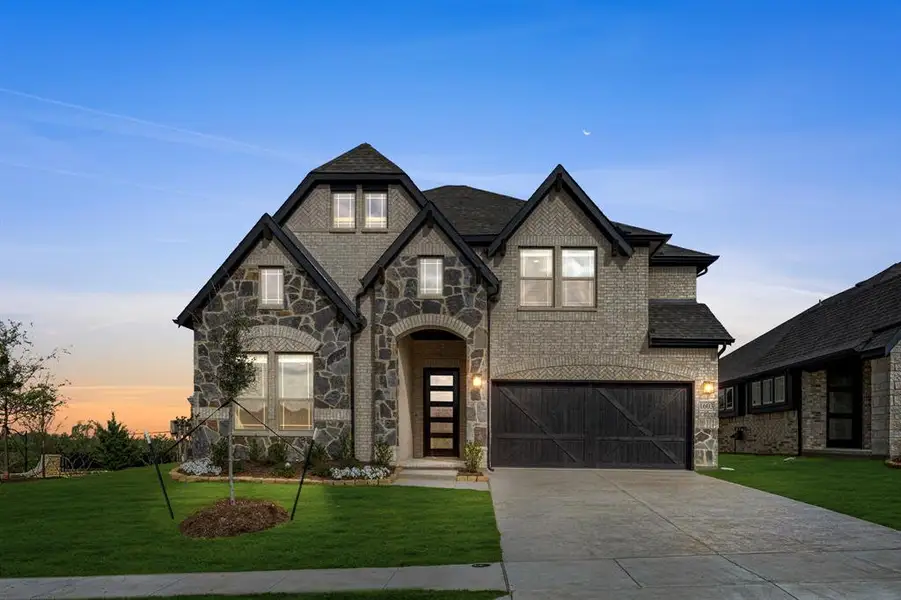 Front exterior of a new home in Devonshire, Forney, TX, highlighting curb appeal (Image 2).