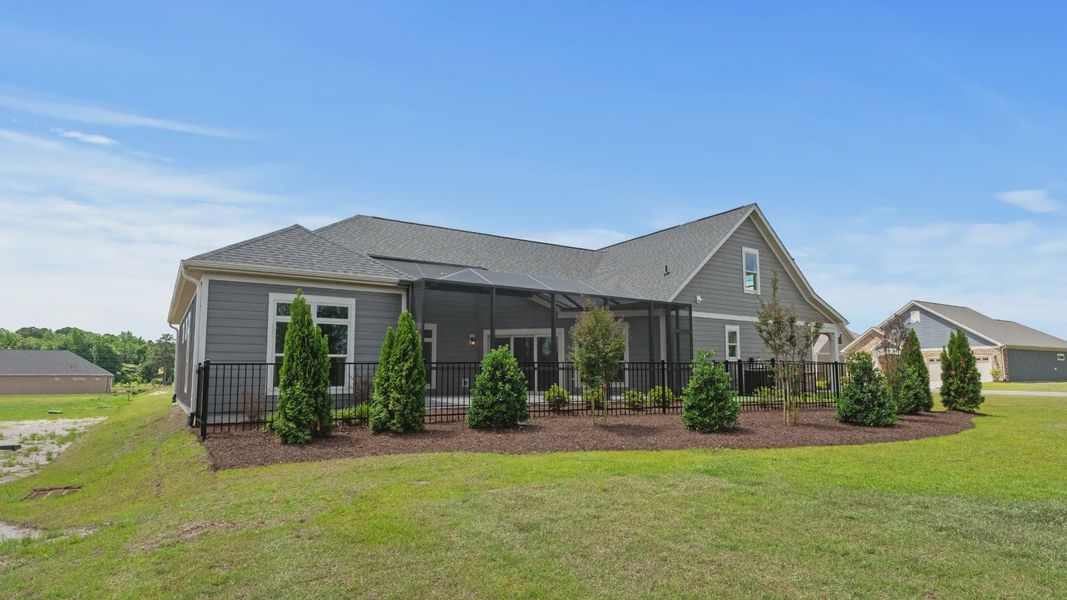 Exterior details and patio area of a home in Courtyards by Carrell, Ocean Isle Beach (Image 20). Exterior details and patio area of a home in Courtyards by Carrell, Ocean Isle Beach (Image 20).