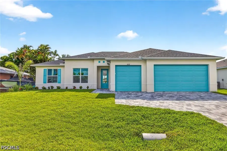Front exterior of a new home in Cape Coral, Cape Coral, FL, highlighting curb appeal (Image 2). Front exterior of a new home in Cape Coral, Cape Coral, FL, highlighting curb appeal (Image 2).