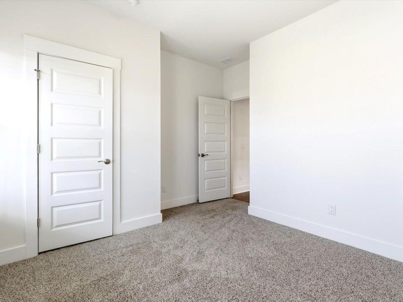 Spacious, unfurnished interior of a new home in The Coves at Lakes of Cane Bay, Summerville (Image 13). Spacious, unfurnished interior of a new home in The Coves at Lakes of Cane Bay, Summerville (Image 13).