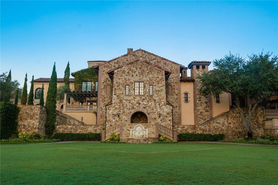 Front exterior of a new home in Bella Collina, Montverde, FL, highlighting curb appeal (Image 2). Front exterior of a new home in Bella Collina, Montverde, FL, highlighting curb appeal (Image 2).
