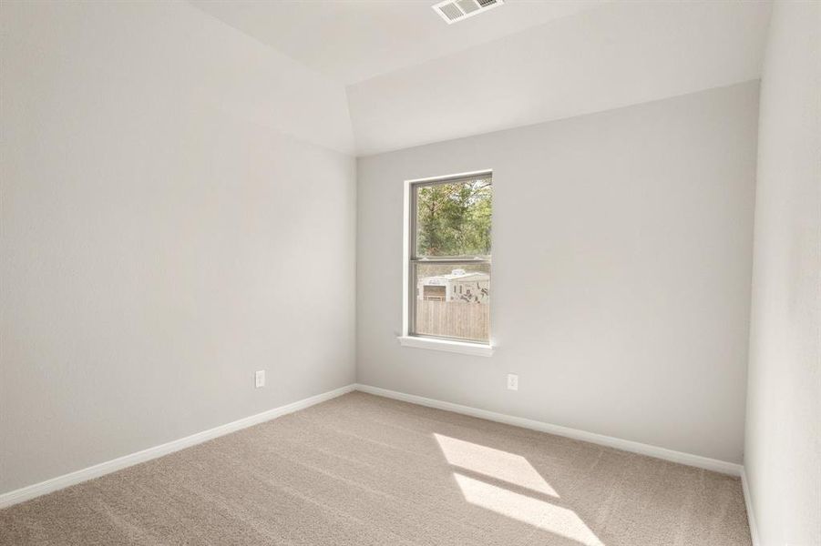 Your secondary bedroom features plush carpet, fresh paint, closet, and a large window that lets in plenty of natural lighting.