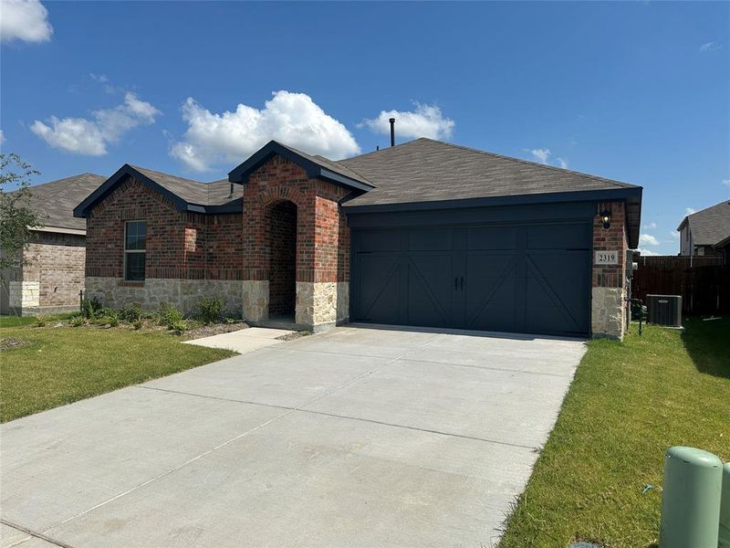 Front exterior of a new home in Cartwright Ranch, Crandall, TX, highlighting curb appeal (Image 1). Front exterior of a new home in Cartwright Ranch, Crandall, TX, highlighting curb appeal (Image 1).