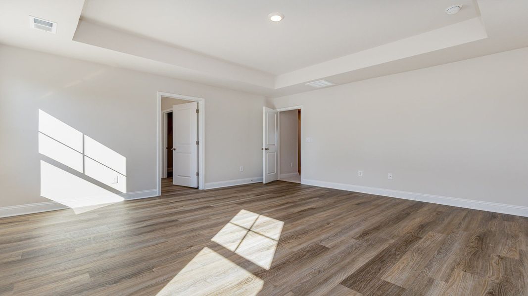 Spacious, unfurnished interior of a new home in The Preserve at Shaftesbury Glen, Conway (Image 17).