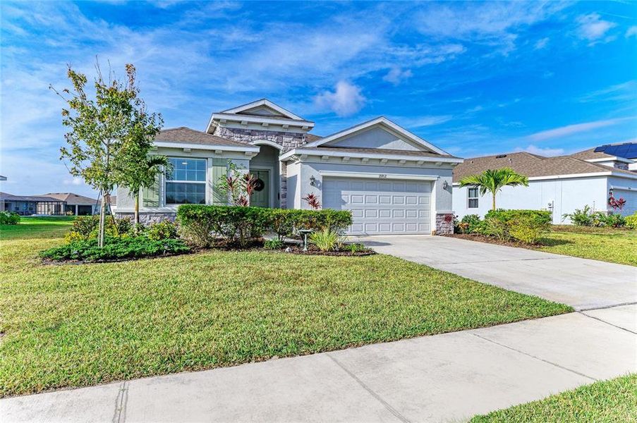 Front exterior of a new home in Coddington, Bradenton, FL, highlighting curb appeal (Image 24). Front exterior of a new home in Coddington, Bradenton, FL, highlighting curb appeal (Image 24).