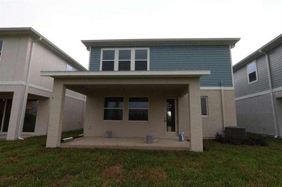 Exterior details and patio area of a home in Persimmon Place – Garden Series, Wesley Chapel (Image 3).