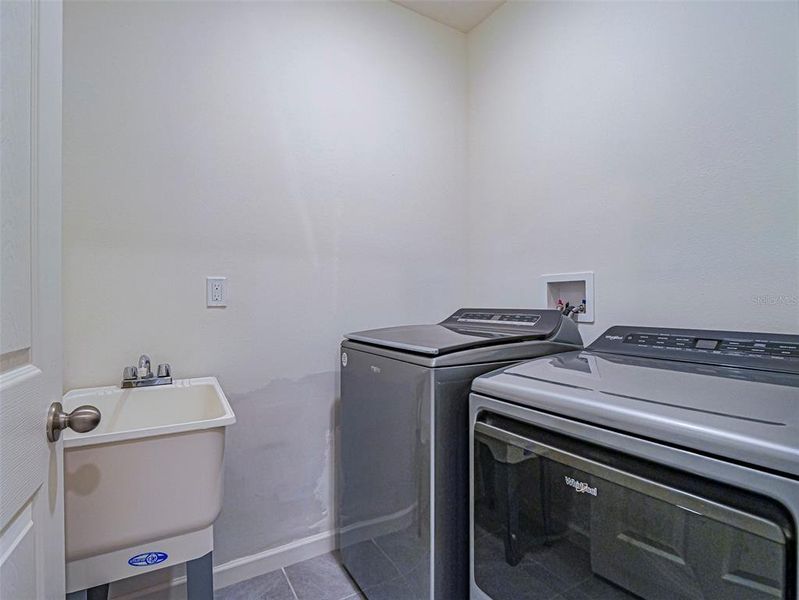 Indoor Laundry with new sink and plubing. Indoor Laundry with new sink and plubing.