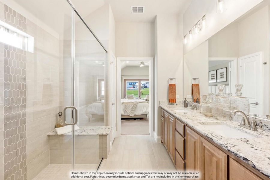 Ensuite bathroom with glass walk-in shower, double vanity with granite countertops, and view into master bedroom.