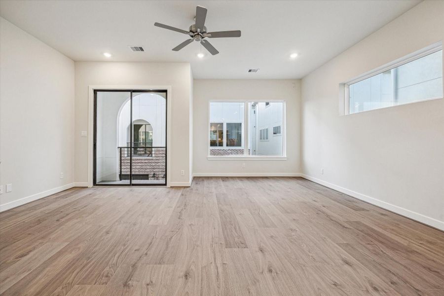 3067 Hicks's spacious living room with abundant natural light and private balcony.
