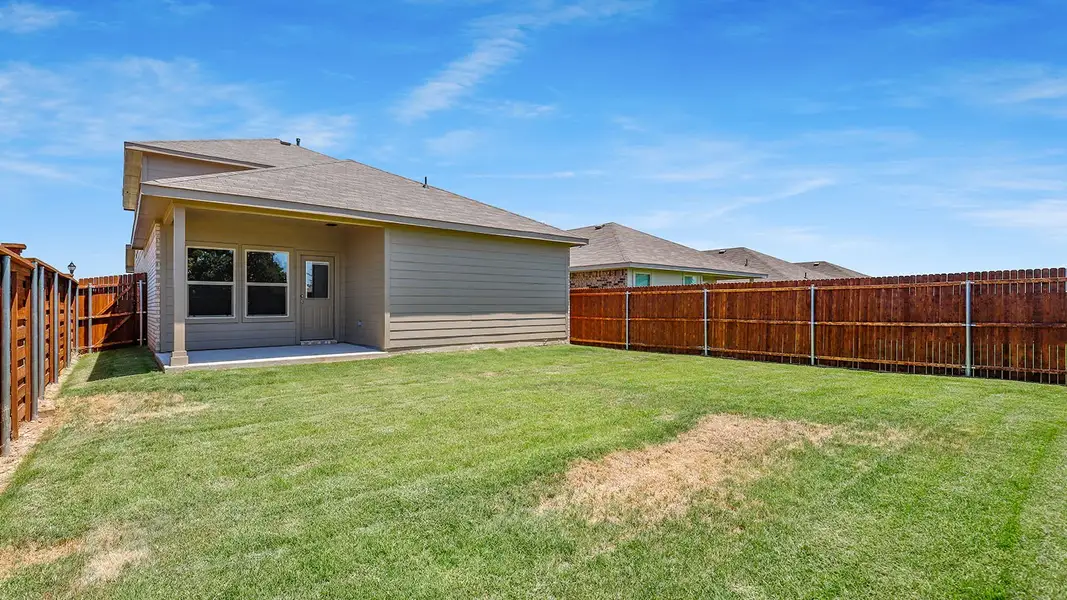 Exterior details and patio area of a home in Monarch at the Meadows, Ponder (Image 3).