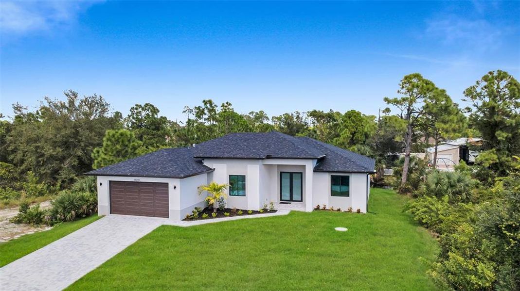 Front exterior of a new home in , Port Charlotte, FL, highlighting curb appeal (Image 17). Front exterior of a new home in , Port Charlotte, FL, highlighting curb appeal (Image 17).