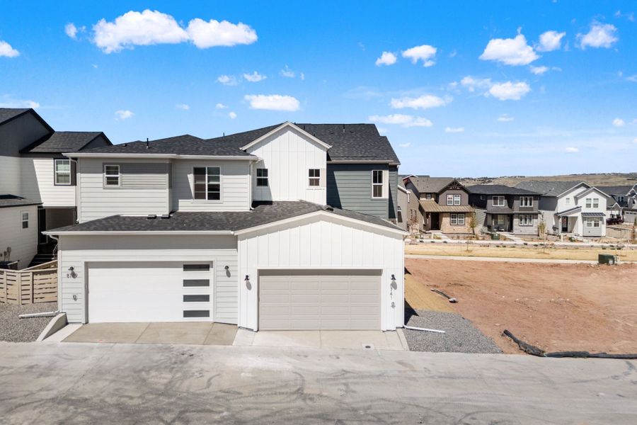 Front exterior of a new home in Trumark Homes at Sterling Ranch, Littleton, CO, highlighting curb appeal (Image 21).