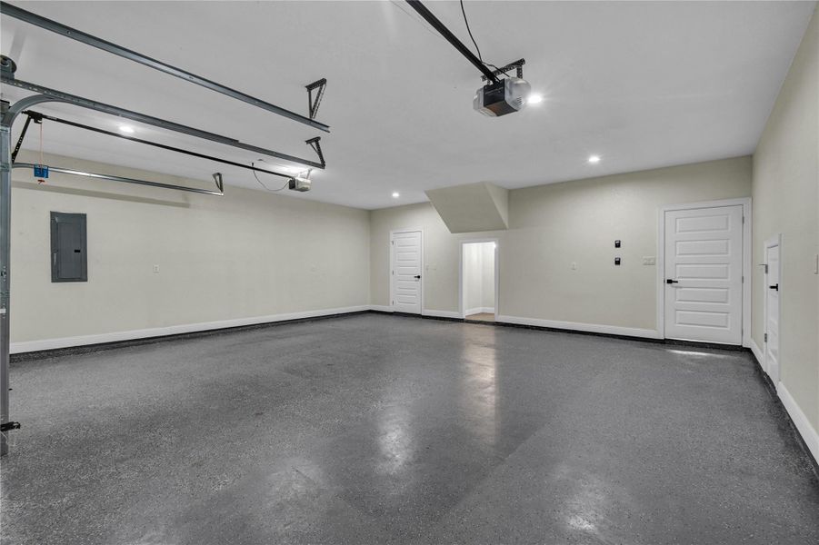 Garage with finished flooring and storage Garage with finished flooring and storage
