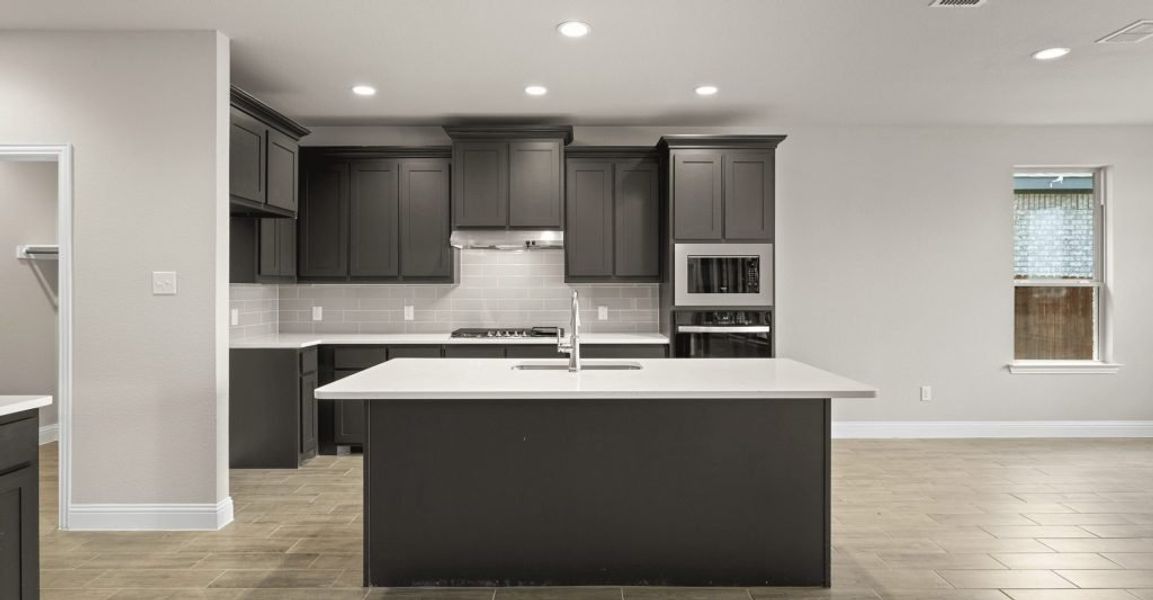 Representative exterior photo of a completed home built from the Donnington by Impression Homes in Still Water Lake, Godley, TX (Image 4).