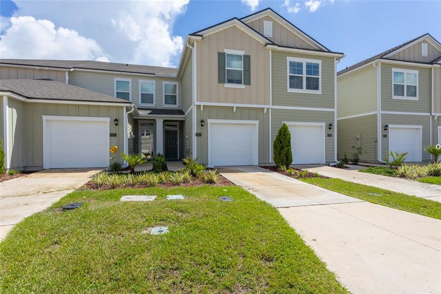 Front exterior of a new home in , Palm Coast, FL, highlighting curb appeal (Image 2).